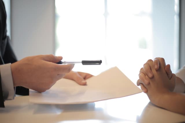 The pen sliding across the desk with the proposal: the date is the part of the document written to get your signature.
